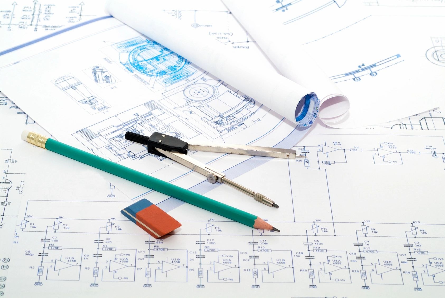 Architect reviewing building plans at desk